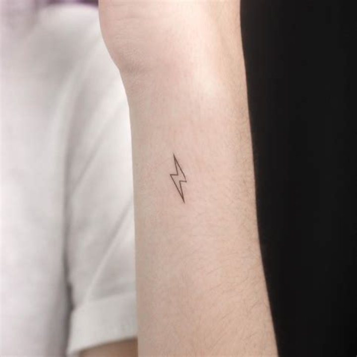 David Raum Lightning Bolt Neck Tattoo Means Victory