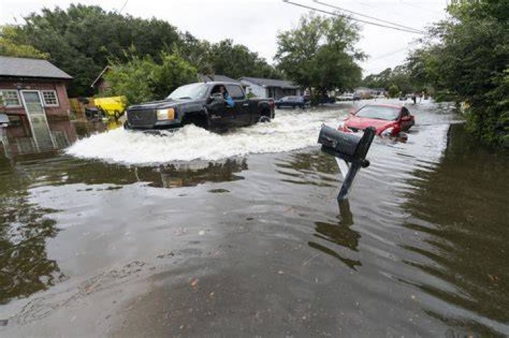 
Hurricane Ian downgraded as it moves out to sea, swamps NYC region 